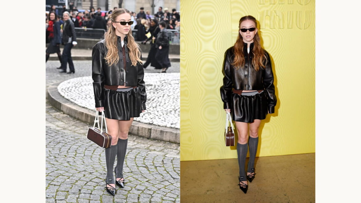 Sydney Sweeney wearing a layered Miu Miu Fall/Winter 2025 look at Paris Fashion Week, styled with leather jacket, mini skirt, and balletcore heels